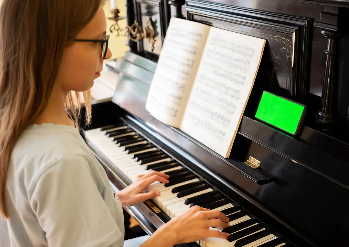 Young girl playing piano
